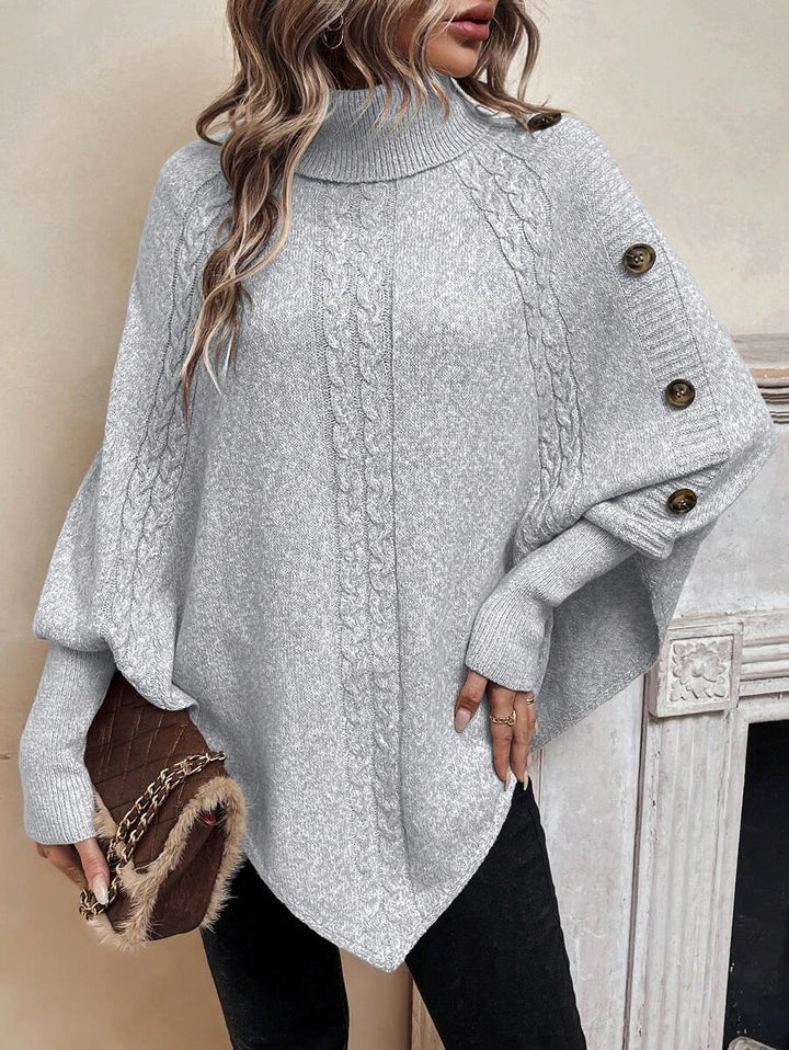 Alexis | Poncho-Sweater mit hohem Kragen und Fledermausärmeln, asymmetrischer Kabelstrick-Pullover